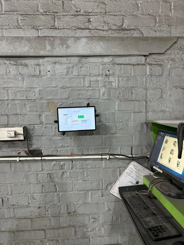 CrewPulse kiosk on a wall-mounted tablet at a final station